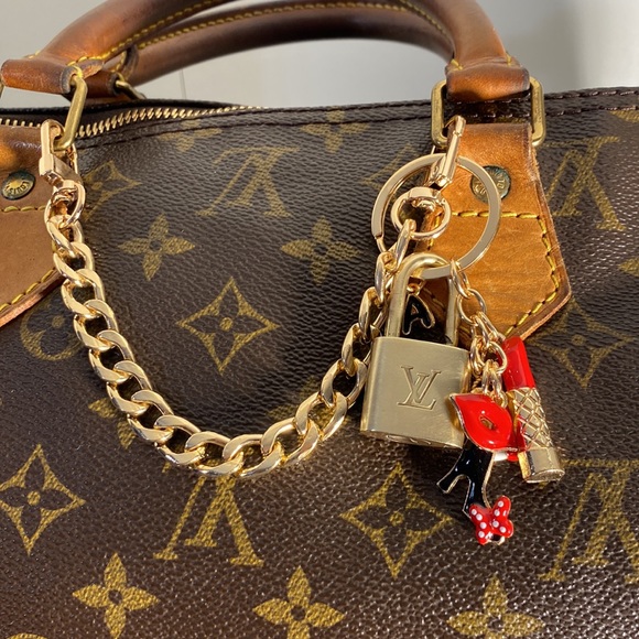 Authentic Louis Vuitton Lock on Charmed chain - Picture 2 of 6